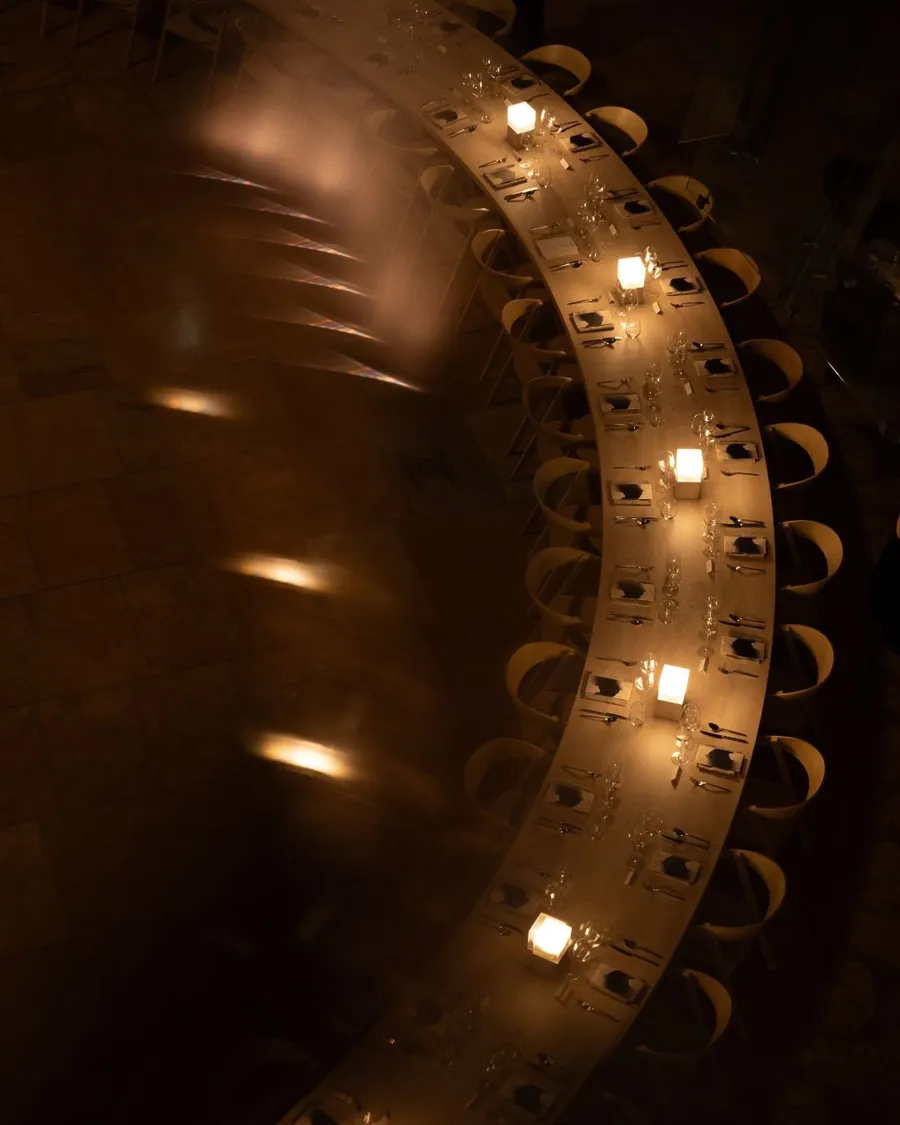 Dom Pérignon Révélations 2026: candlelit table seen from above