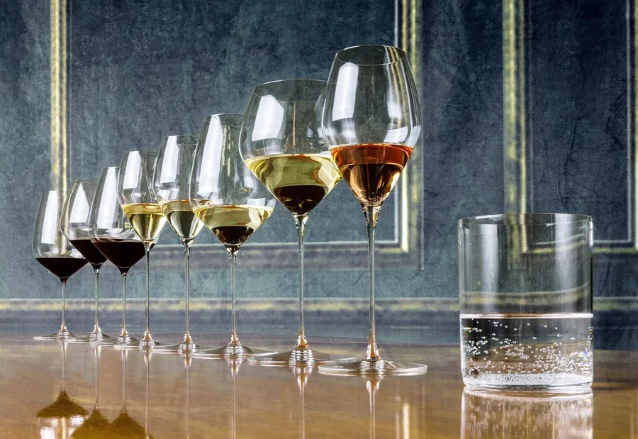 RIEDEL glasses in different shapes and sizes on a bar