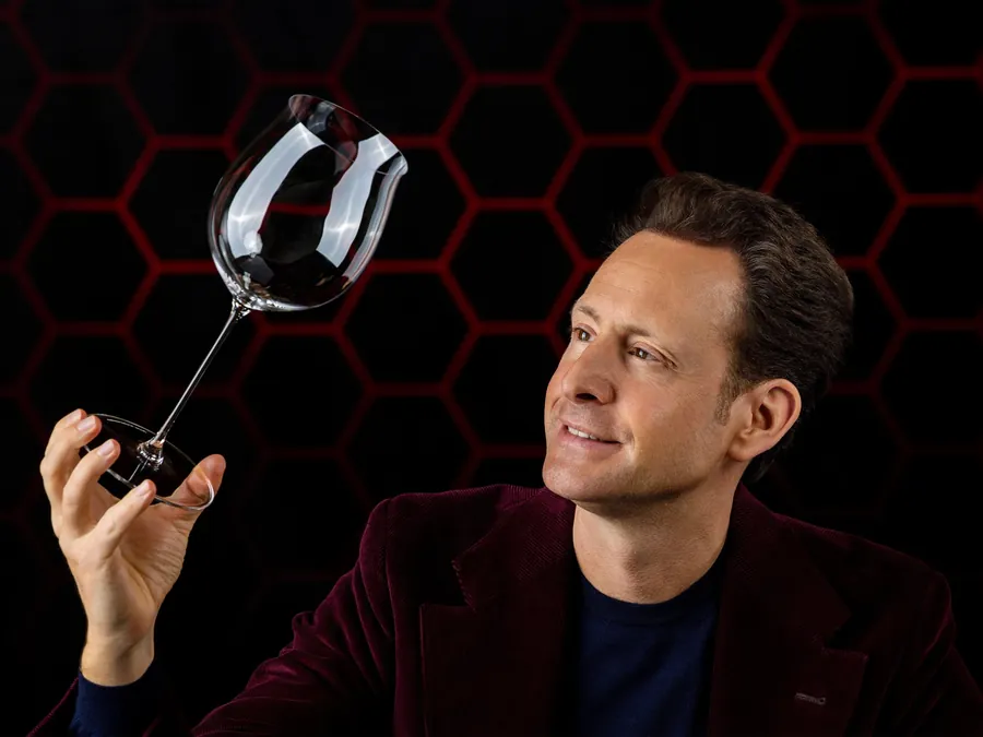 Maximilian Riedel holding up a RIEDEL wine glass